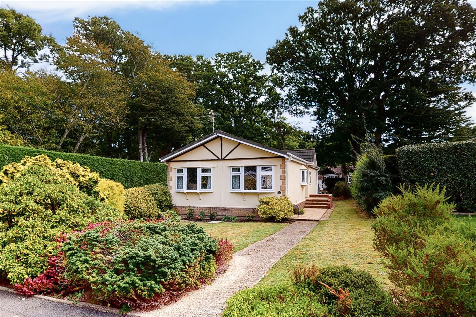 Property Details for Fox Hollow Deanland Wood Park BN27 3SZ Stevens and Carter Estate Agents